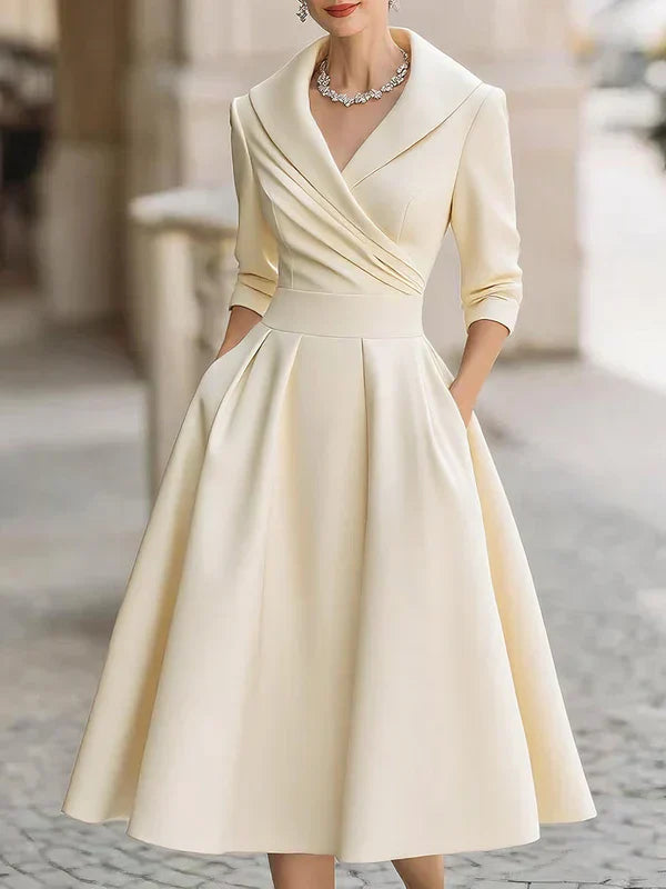 Lenka – Elegantní Midi Šaty s Praktickými Kapsami